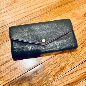 SOLDLouis Vuitton Empreinte Sarah wallet